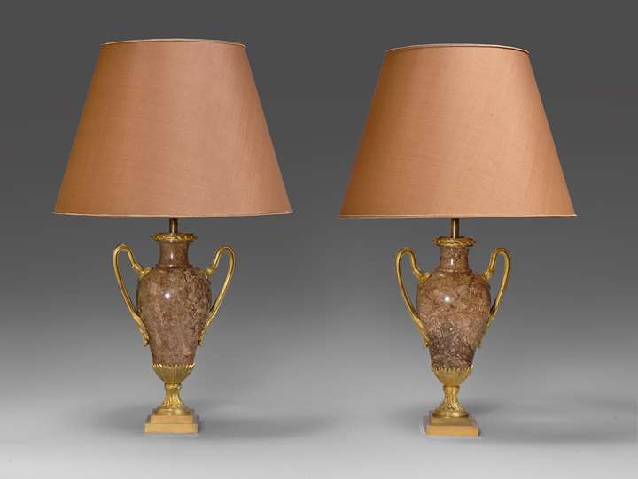 A pair of neoclassical marble vases, mounted as lamps